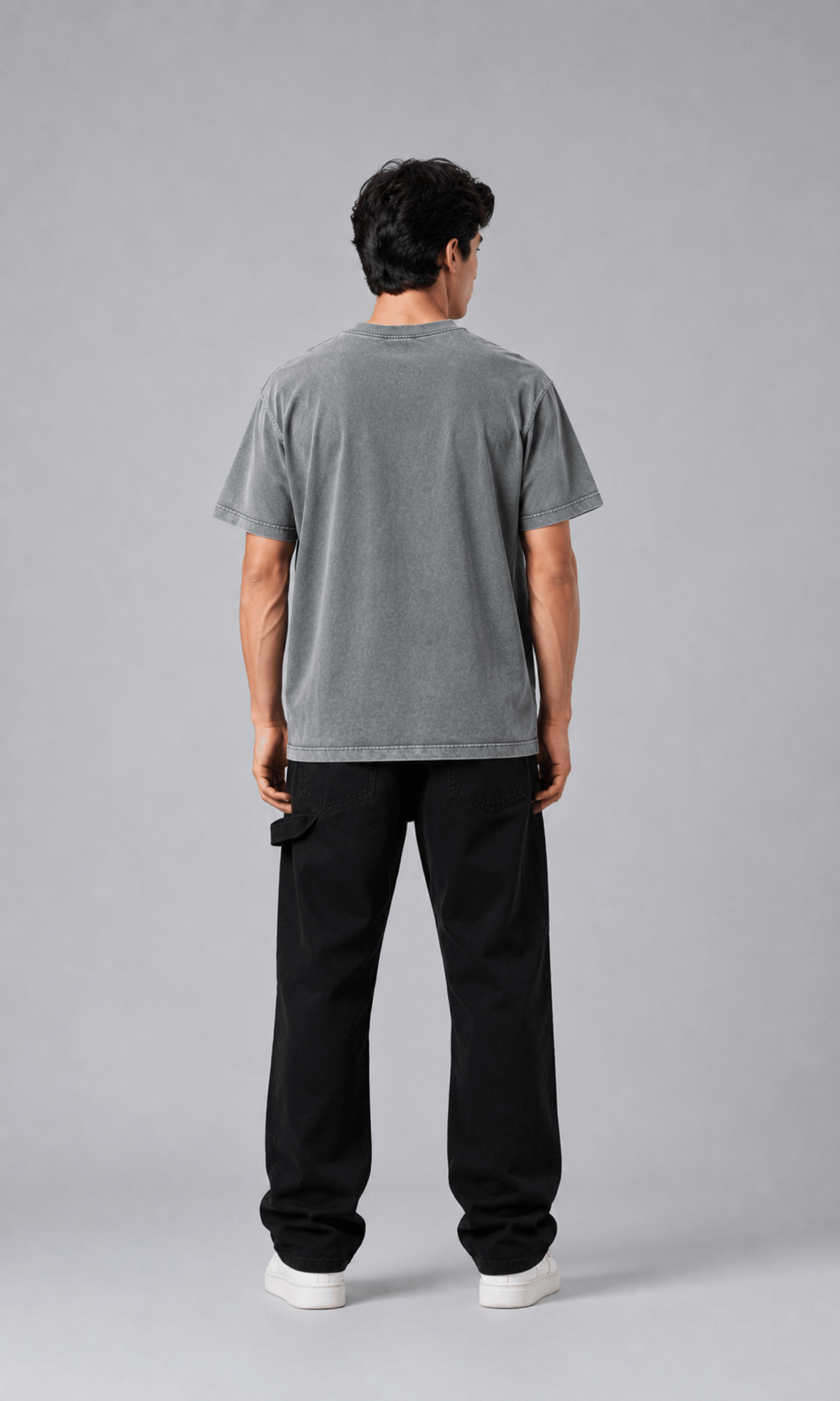 Male model wearing acid wash grey oversized t-shirt full body front