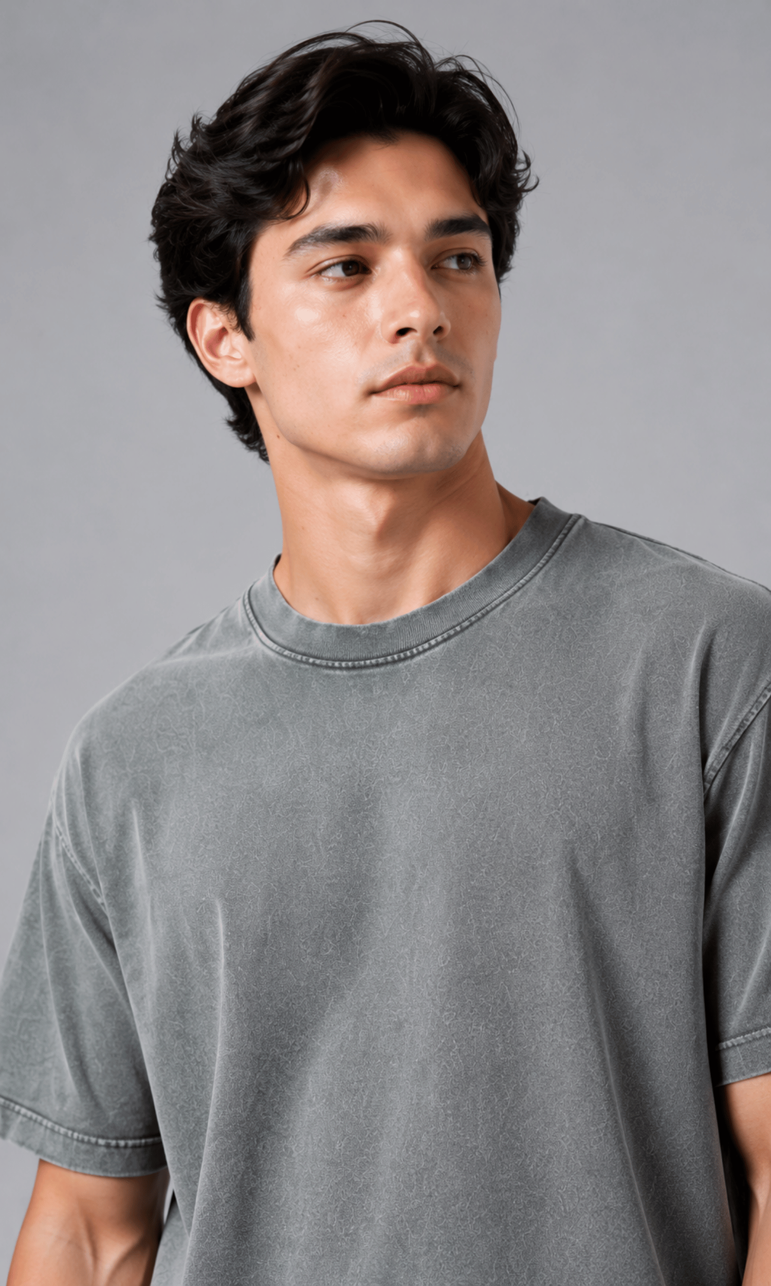 Close up of male model wearing acid wash grey oversized t-shirt