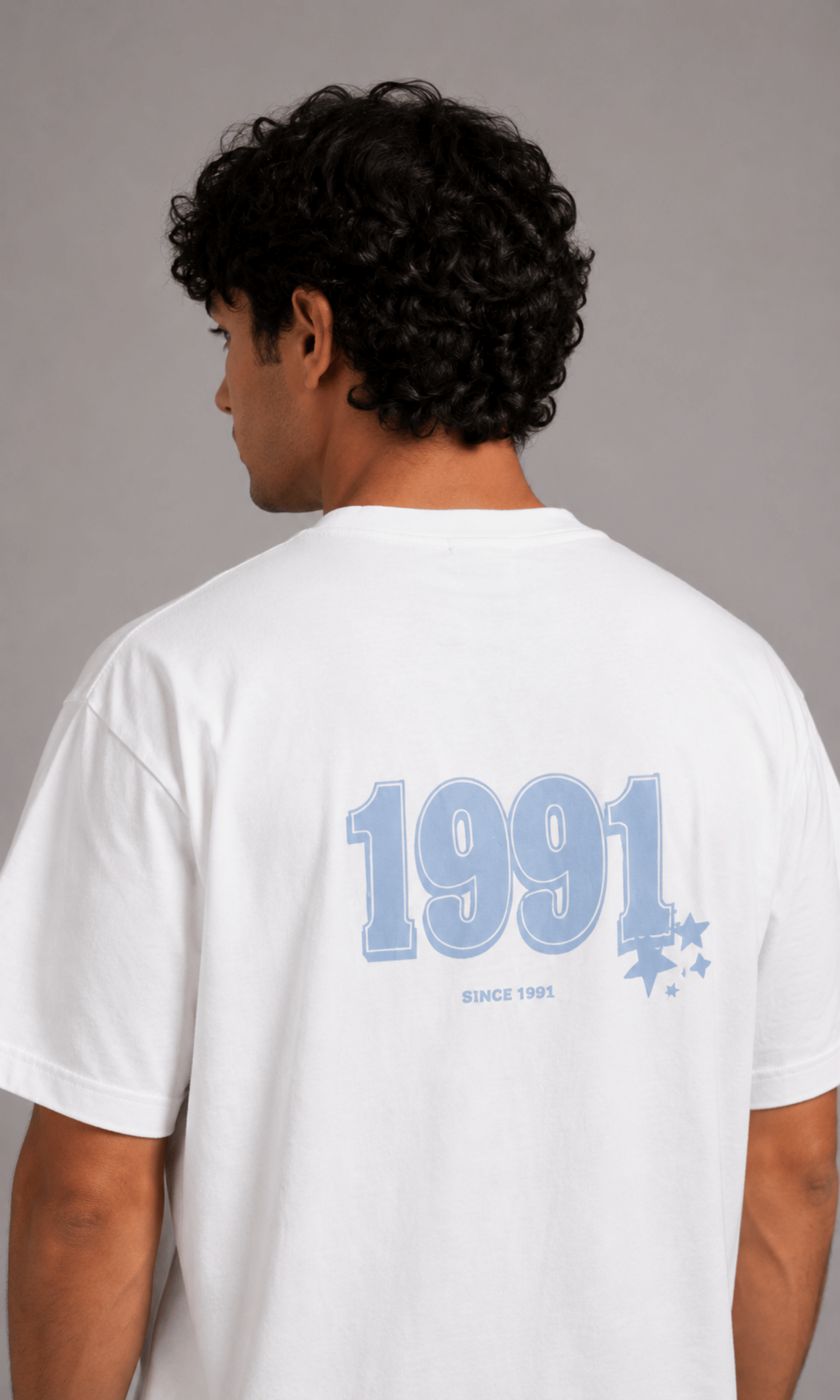 Model wearing Pull&Bear 1991 Oversized Graphic Tee - back view full body